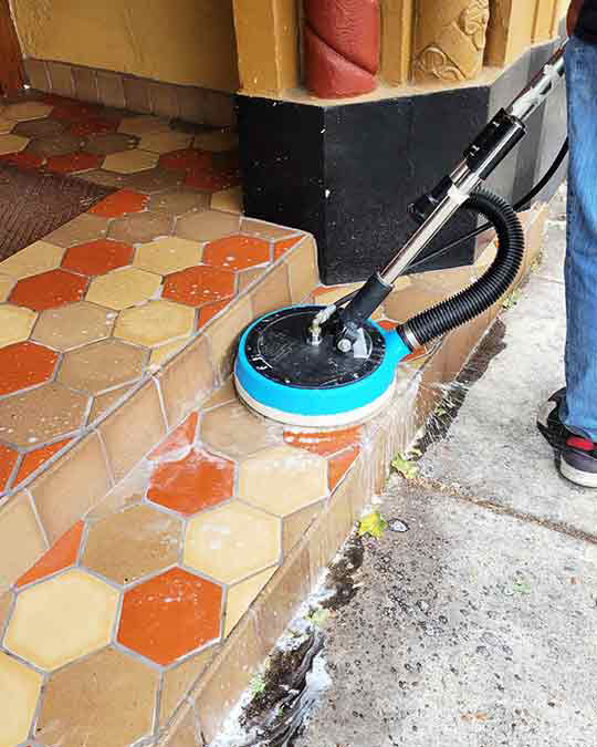 scrubbing floor tiles