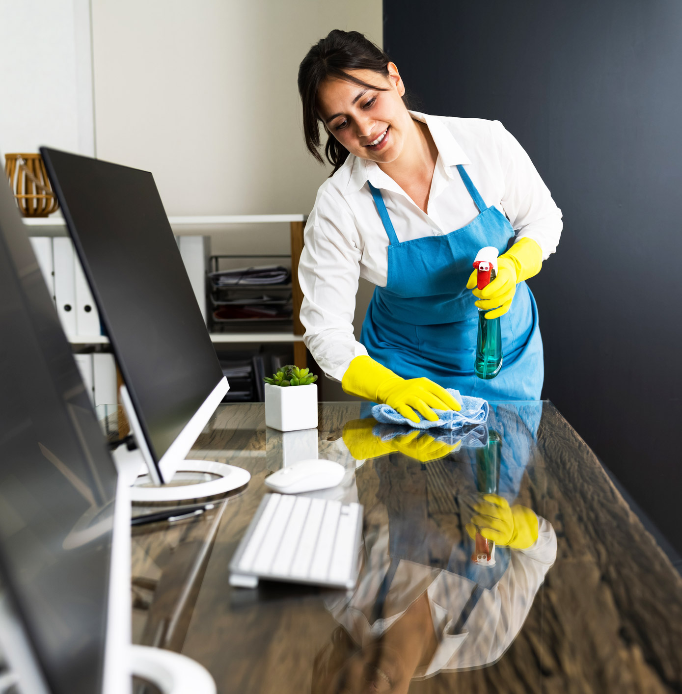 female janitor cleaning desks