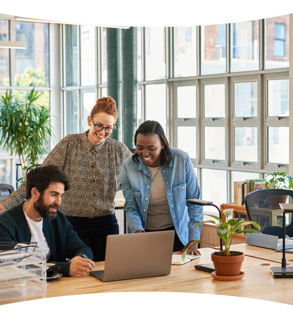 a group of coworkers meeting in a clean office