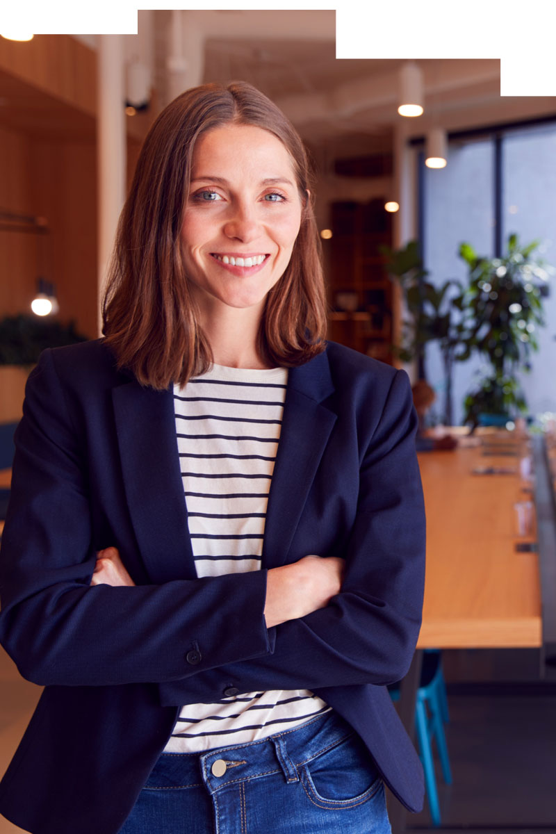 Satisfied business woman proud of clean workplace.